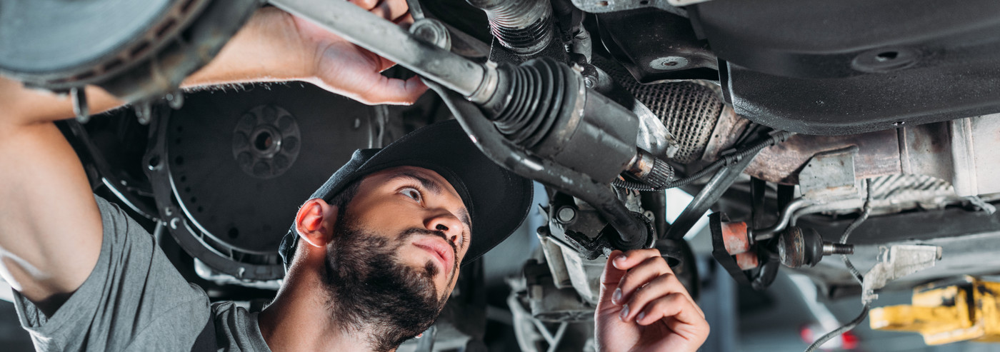 Mechanic looking underneath a vehicle - Car Repairs Rochester